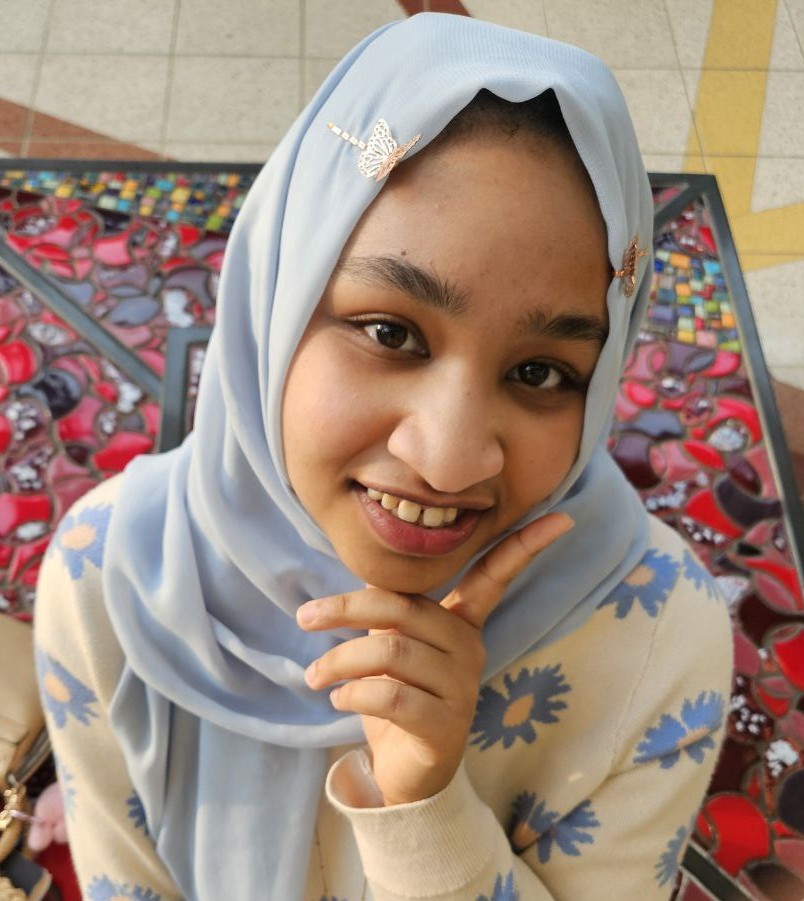 Friendly hijabi girl (Yumna) smiling at the viewer