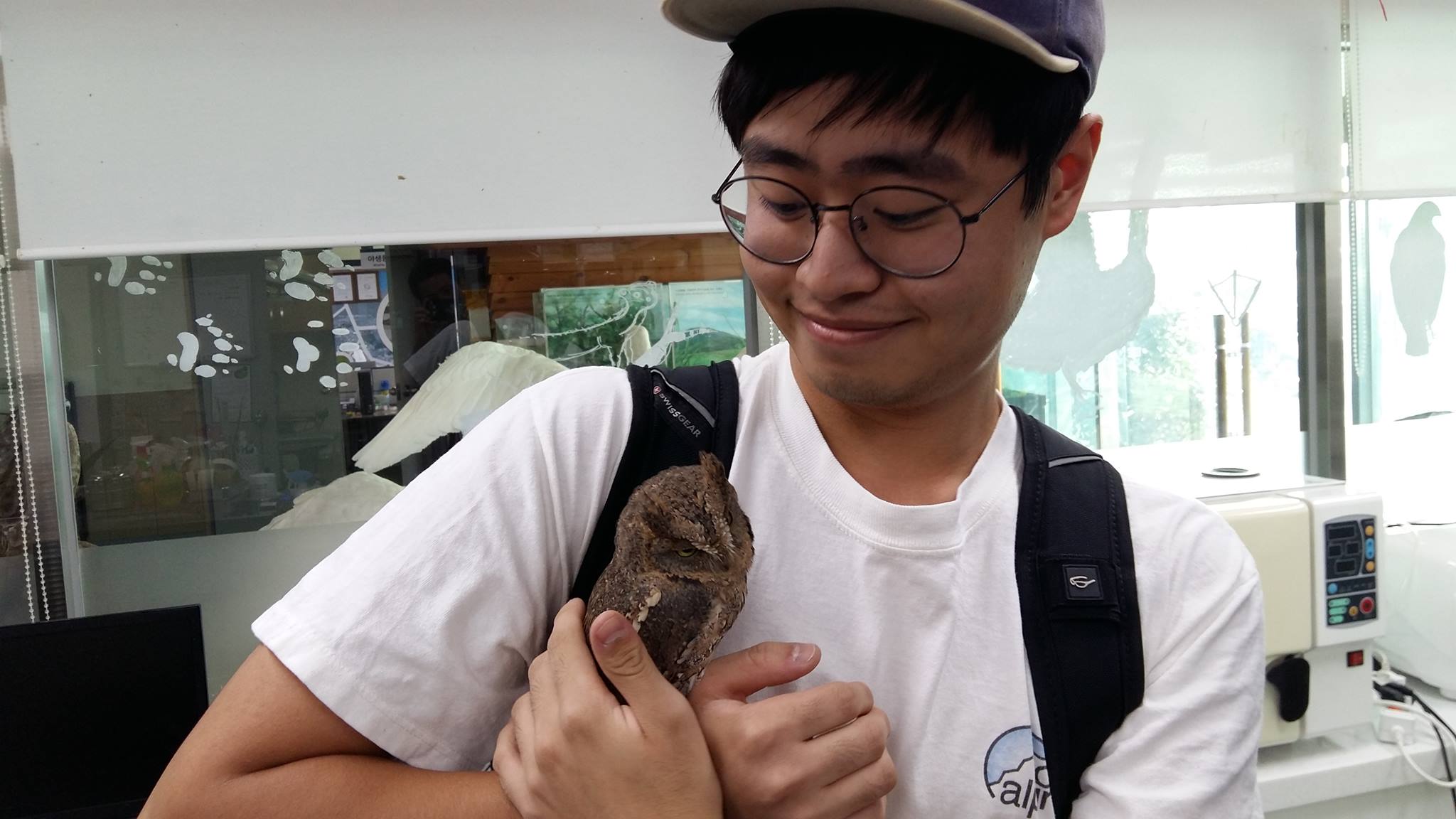 Photo of Dennis holding an animal